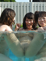 Asian girl have fun in the glass pool