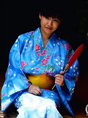 Ayami Sakurai posing big breasts in colored suite