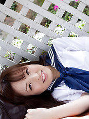 Maho Kimura Asian undresses school uniform right in the park