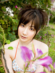 Anna Nakagawa Asian in bath suit is playful next to the pool